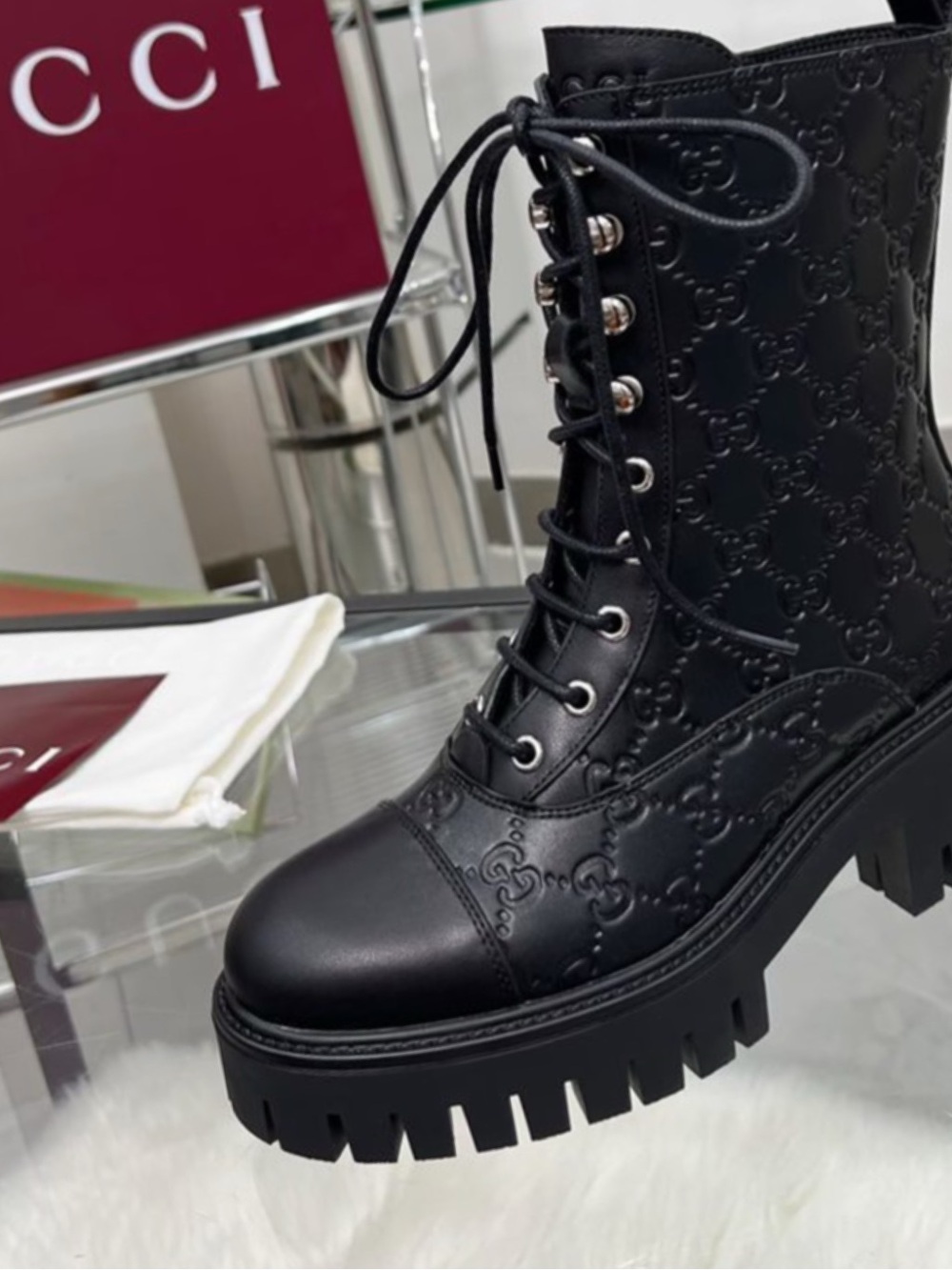 Gucci Black Embossed Logo Lace-Up Combat Boots